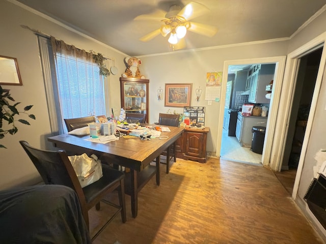 523 Bryson Ave, Athens, TX 75751 - dining space featuring light wood-type flooring, a ceiling fan, and crown molding