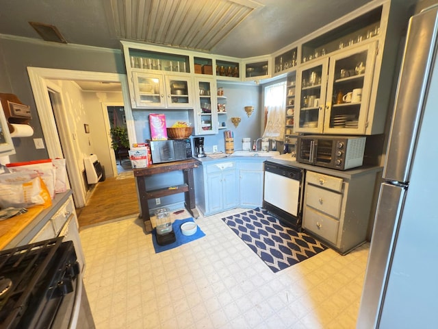 523 Bryson Ave, Athens, TX 75751 - kitchen featuring dishwasher, freestanding refrigerator, tile patterned floors, open shelves, and crown molding