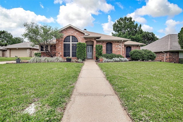 5307 Oak Branch Dr, Arlington, TX 76016 - view of front of home featuring brick siding, a front lawn, and a shingled roof