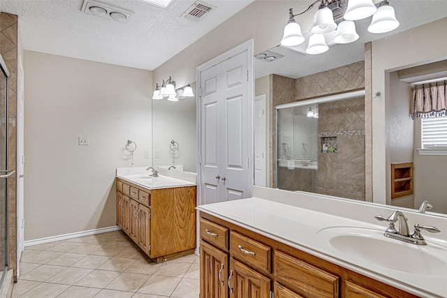 5307 Oak Branch Dr, Arlington, TX 76016 - bathroom with a stall shower, vanity, a textured ceiling, tile patterned flooring, and a chandelier
