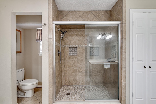 5307 Oak Branch Dr, Arlington, TX 76016 - full bath with a shower stall, a closet, tile patterned floors, and a textured ceiling