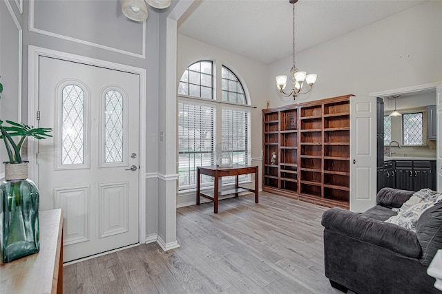 5307 Oak Branch Dr, Arlington, TX 76016 - foyer with a chandelier and light wood finished floors