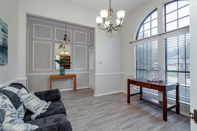 5307 Oak Branch Dr, Arlington, TX 76016 - living room featuring a chandelier, healthy amount of natural light, and light wood finished floors