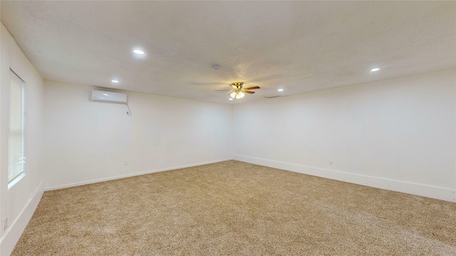1608 Holt St, Fort Worth, TX 76103 - unfurnished room with light carpet, recessed lighting, a wall unit AC, and a ceiling fan