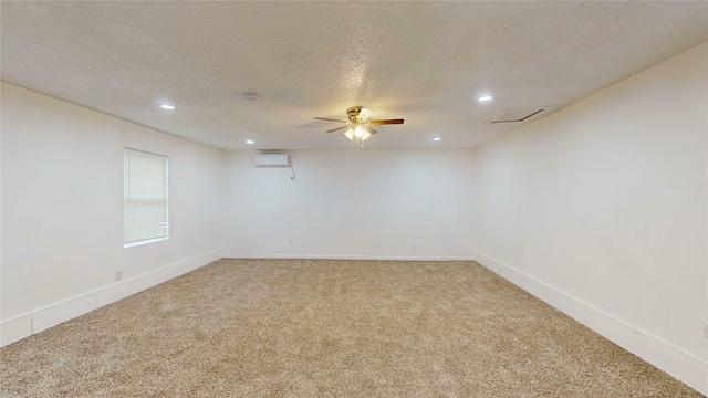 1608 Holt St, Fort Worth, TX 76103 - unfurnished room with light carpet, an AC wall unit, recessed lighting, a textured ceiling, and ceiling fan