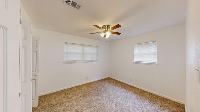 1608 Holt St, Fort Worth, TX 76103 - empty room with light colored carpet and a ceiling fan