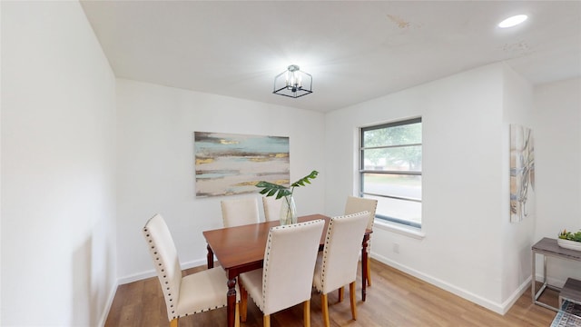 1608 Holt St, Fort Worth, TX 76103 - dining space featuring light wood finished floors, a chandelier, and recessed lighting