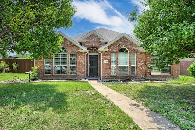 703 Monterey Dr, Rockwall, TX 75087 - view of front facade featuring brick siding