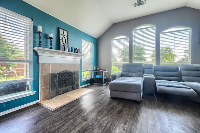 703 Monterey Dr, Rockwall, TX 75087 - living room with lofted ceiling, a fireplace, and wood finished floors