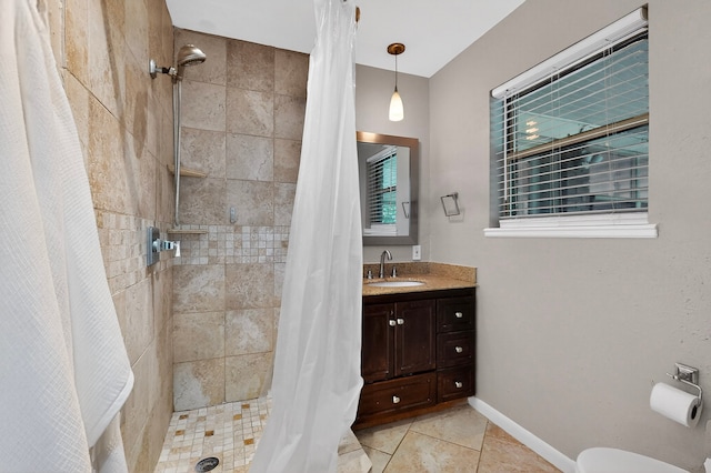 5417 Jane Anne St, Haltom City, TX 76117 - bathroom with tiled shower, vanity, and tile patterned flooring