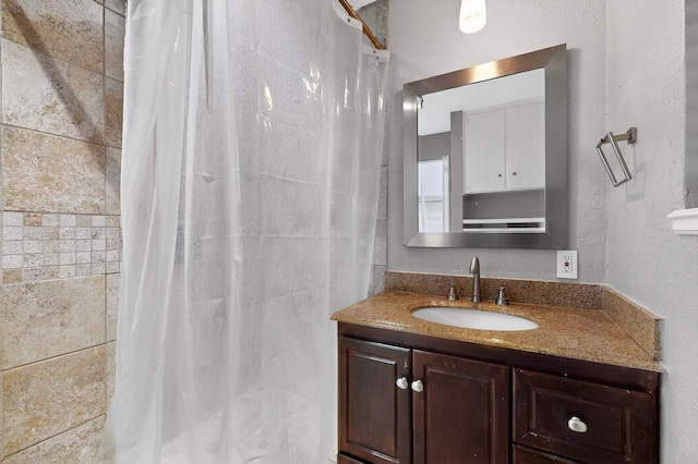 5417 Jane Anne St, Haltom City, TX 76117 - full bathroom featuring vanity and a tile shower
