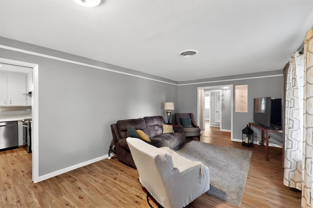 5417 Jane Anne St, Haltom City, TX 76117 - living room with light wood-style floors and baseboards