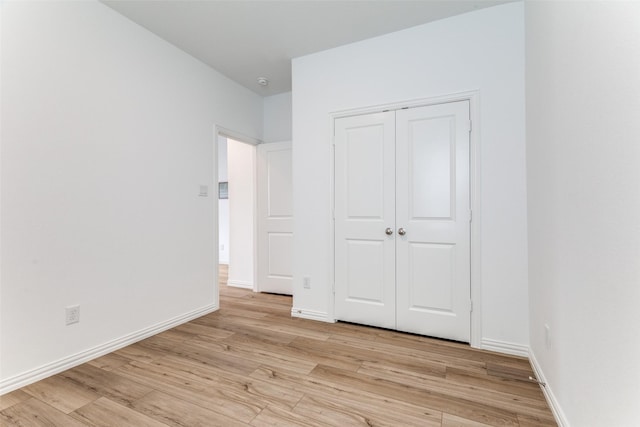 1233 Western Yarrow Ave, Justin, TX 76247 - unfurnished bedroom featuring light wood-style flooring and a closet