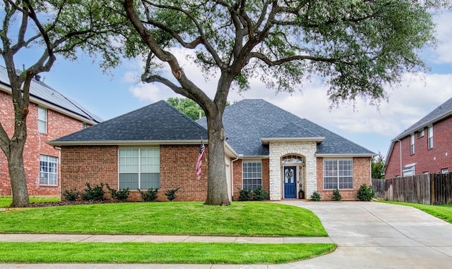 400 Patricia Ln, Highland Village, TX 75077 - view of front of property featuring a shingled roof, brick siding, and concrete driveway