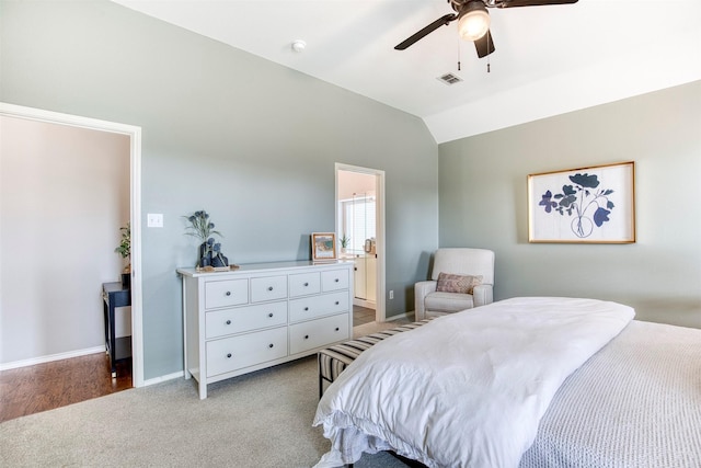 400 Patricia Ln, Highland Village, TX 75077 - bedroom with vaulted ceiling, light colored carpet, ceiling fan, and ensuite bath