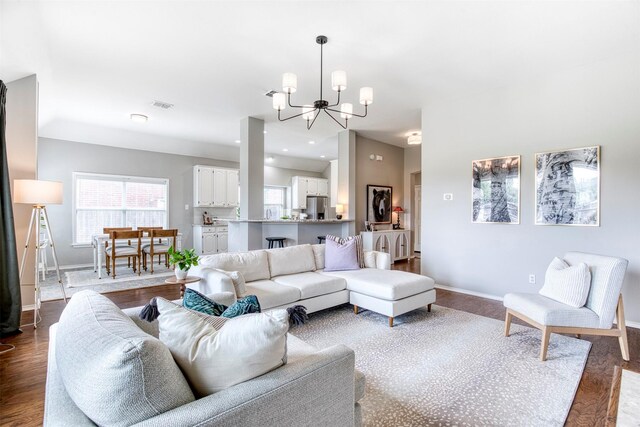 400 Patricia Ln, Highland Village, TX 75077 - living room featuring a chandelier and dark wood-style floors