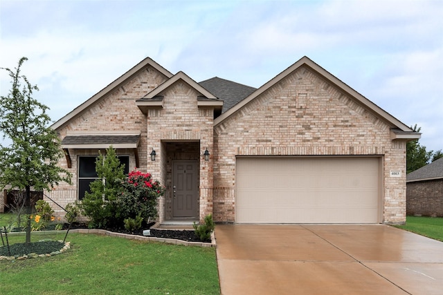 4003 Bendale Rd, Benbrook, TX 76116 - view of front of house with driveway, a garage, brick siding, and a front lawn