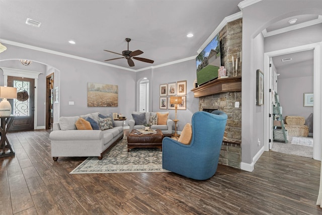 6202 Carrizo Dr, De Cordova, TX 76049 - living room featuring arched walkways, wood finished floors, ceiling fan, a fireplace, and recessed lighting