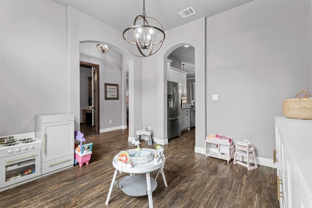 6202 Carrizo Dr, De Cordova, TX 76049 - dining space with arched walkways, dark wood-type flooring, and a chandelier