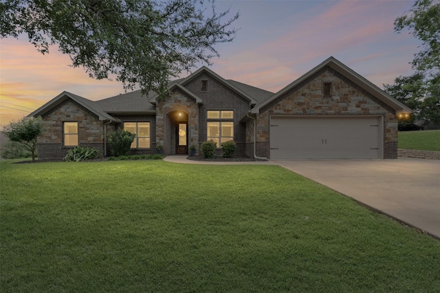 6202 Carrizo Dr, De Cordova, TX 76049 - view of front of house with an attached garage, a lawn, driveway, and stone siding
