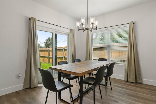 532 W Florence St, Denison, TX 75020 - dining space featuring a chandelier and wood finished floors