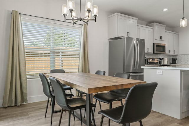 532 W Florence St, Denison, TX 75020 - dining space featuring healthy amount of natural light, a chandelier, recessed lighting, and light wood finished floors