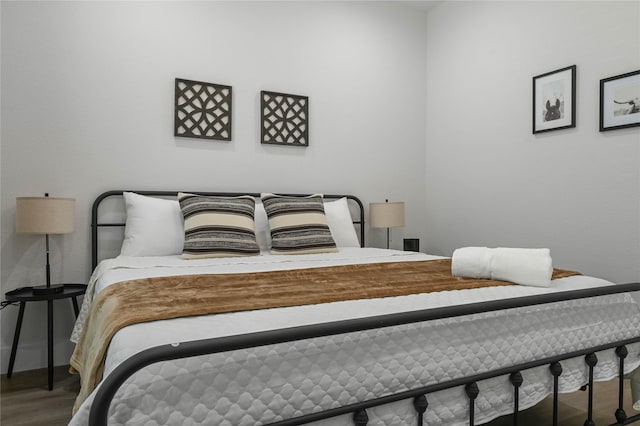 532 W Florence St, Denison, TX 75020 - bedroom with wood finished floors and baseboards