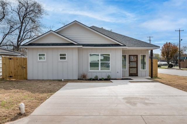 532 W Florence St, Denison, TX 75020 - view of front facade featuring board and batten siding and roof with shingles