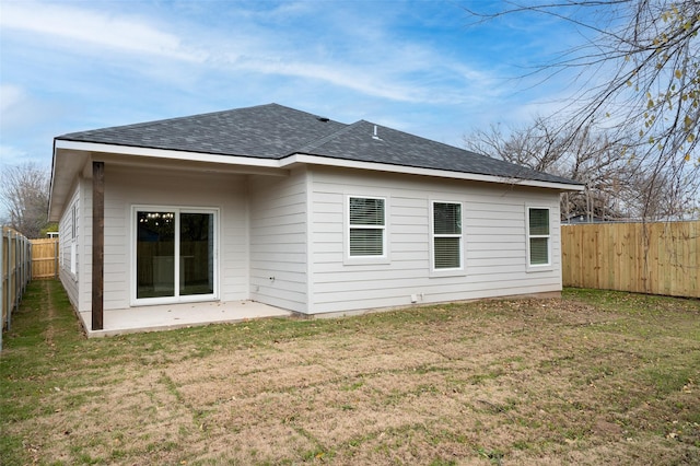 532 W Florence St, Denison, TX 75020 - back of house featuring roof with shingles, a fenced backyard, and a patio
