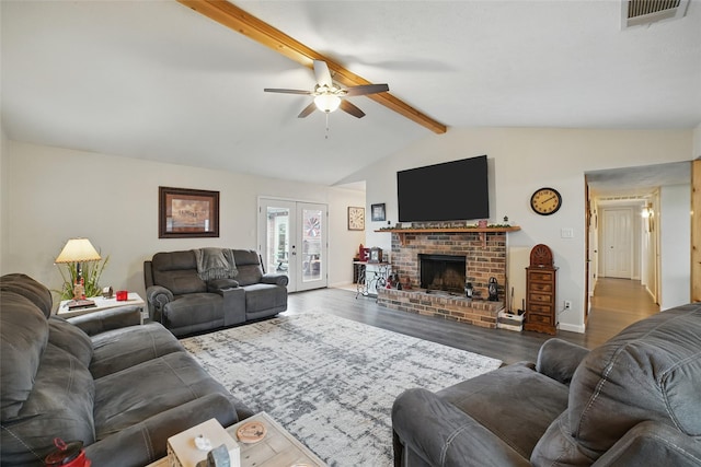 4328 Coryell Way, Mesquite, TX 75150 - living room featuring ceiling fan, wood finished floors, french doors, and a brick fireplace