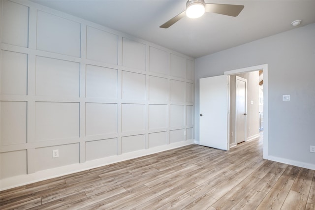2238 Rook Dr, Dallas, TX 75211 - empty room with a decorative wall, light wood-type flooring, and ceiling fan