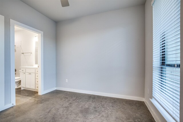 2238 Rook Dr, Dallas, TX 75211 - unfurnished bedroom featuring carpet, connected bathroom, and a ceiling fan