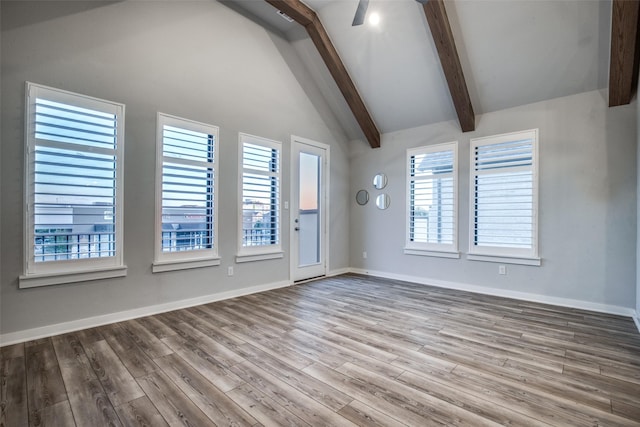 2238 Rook Dr, Dallas, TX 75211 - spare room with beam ceiling, wood finished floors, a ceiling fan, and high vaulted ceiling