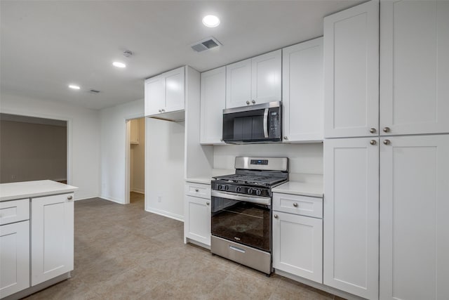 5125 Yucca Ct, Arlington, TX 76017 - kitchen featuring stainless steel appliances, light countertops, white cabinets, and recessed lighting