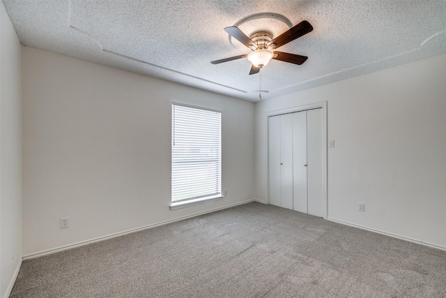 5125 Yucca Ct, Arlington, TX 76017 - empty room with carpet flooring, a textured ceiling, and a ceiling fan