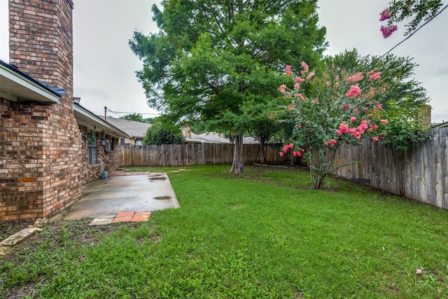 5125 Yucca Ct, Arlington, TX 76017 - fenced backyard with a patio area