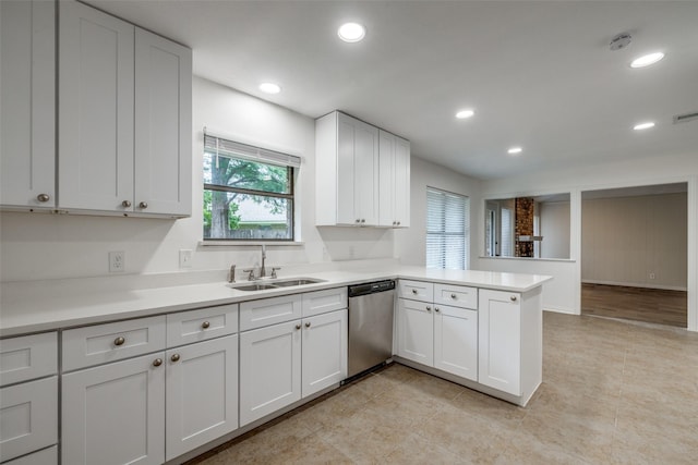 5125 Yucca Ct, Arlington, TX 76017 - kitchen featuring stainless steel dishwasher, a peninsula, light countertops, white cabinetry, and recessed lighting