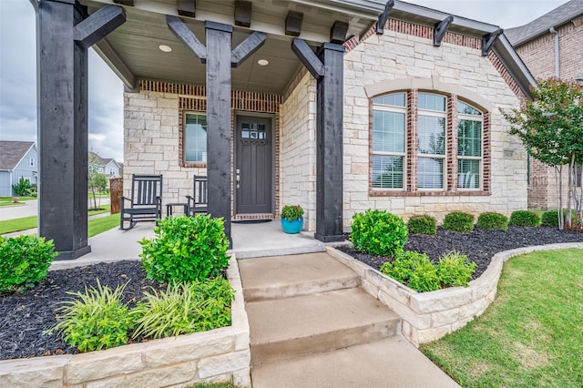 3418 River Trl, Frisco, TX 75034 - entrance to property featuring stone siding and a porch
