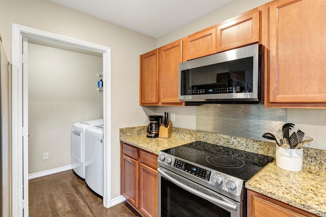 1837 Trego Dr, Fort Worth, TX 76247 - kitchen featuring stainless steel appliances, dark wood-style floors, light stone countertops, and washer and dryer