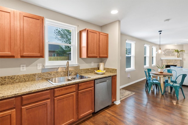 1837 Trego Dr, Fort Worth, TX 76247 - kitchen with dishwasher, dark wood-type flooring, plenty of natural light, light stone counters, and recessed lighting