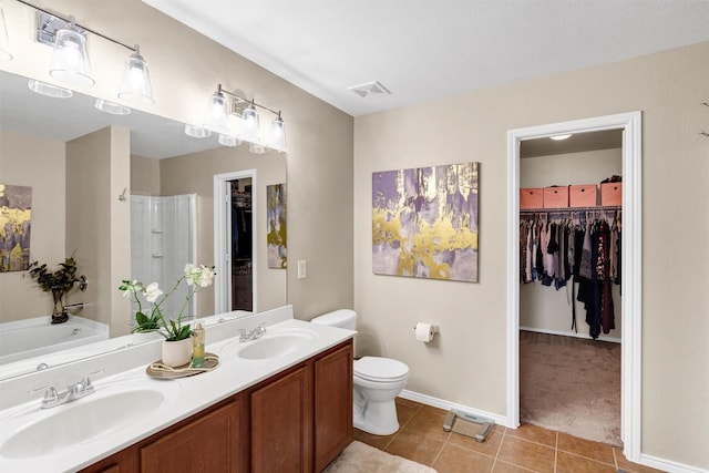 1837 Trego Dr, Fort Worth, TX 76247 - full bath with tile patterned flooring, a walk in closet, a shower stall, double vanity, and a garden tub