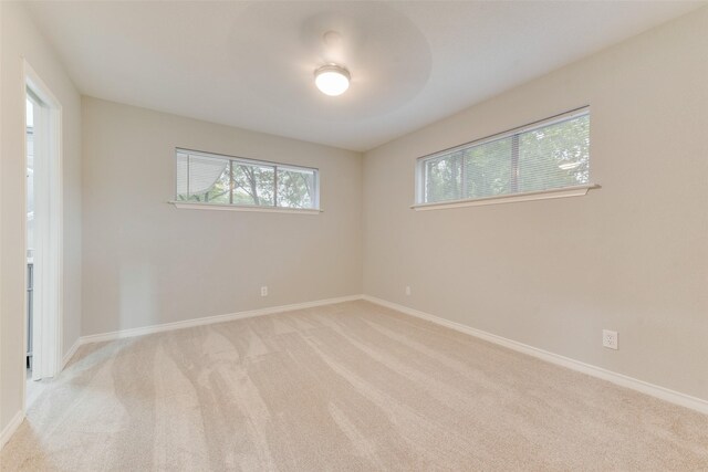 523 Frank Keasler, Duncanville, TX 75116 - unfurnished room featuring light colored carpet and baseboards