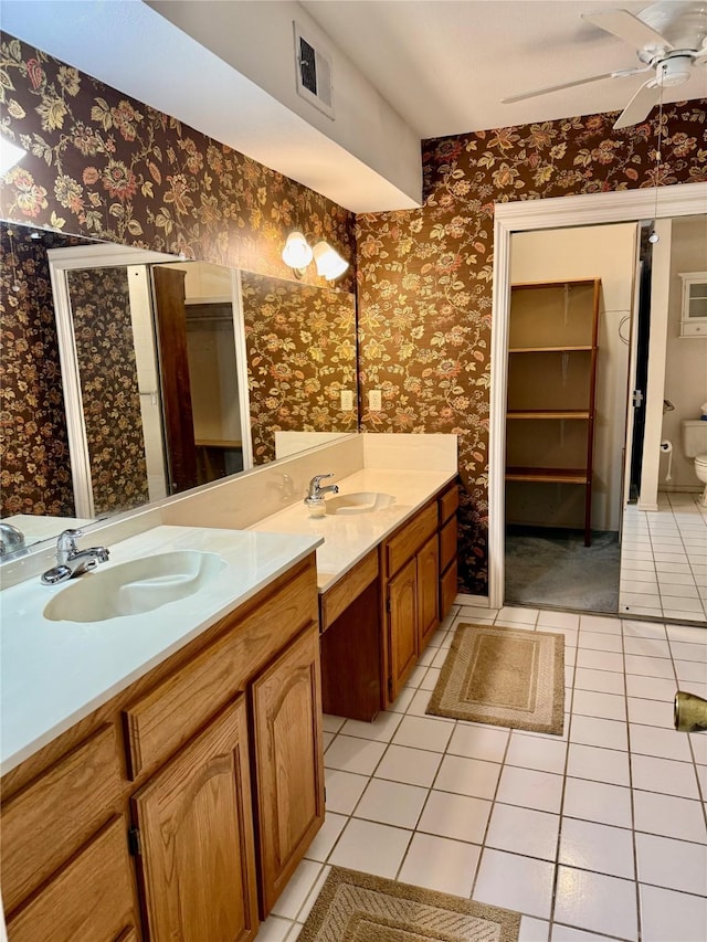 2909 Troy Rd, Wylie, TX 75098 - full bathroom with wallpapered walls, tile patterned floors, vanity, and a ceiling fan