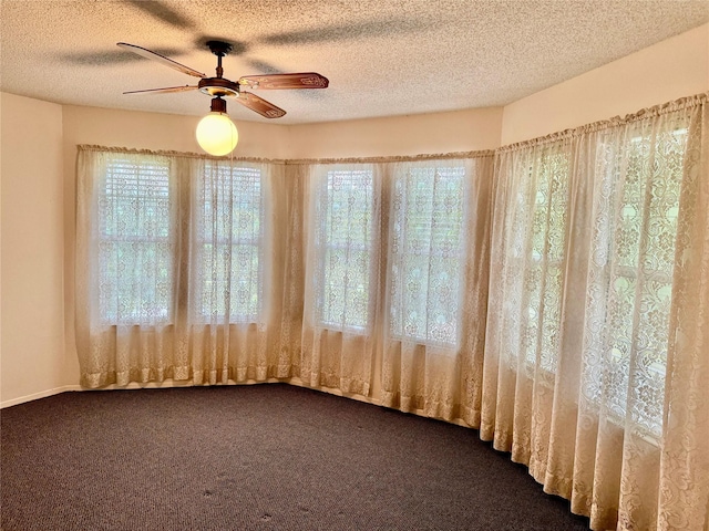 2909 Troy Rd, Wylie, TX 75098 - empty room with dark colored carpet, ceiling fan, and a textured ceiling