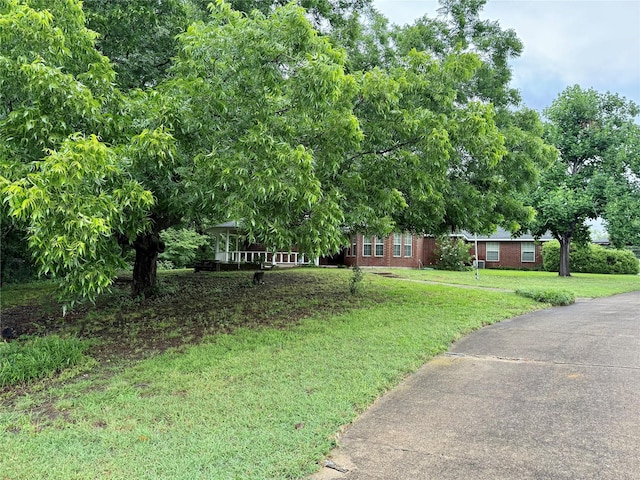 2909 Troy Rd, Wylie, TX 75098 - view of front facade featuring brick siding and a front lawn