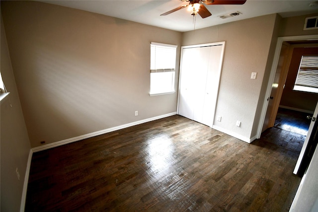 2625 Fairbrook St, Irving, TX 75062 - unfurnished bedroom featuring dark wood-style flooring, a closet, and ceiling fan