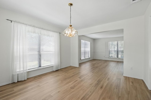 1800 Chatham Dr, Flower Mound, TX 75028 - spare room with a chandelier and light wood-type flooring