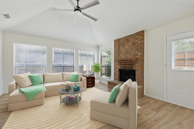 1800 Chatham Dr, Flower Mound, TX 75028 - living area featuring light wood-style flooring, ceiling fan, a brick fireplace, and high vaulted ceiling