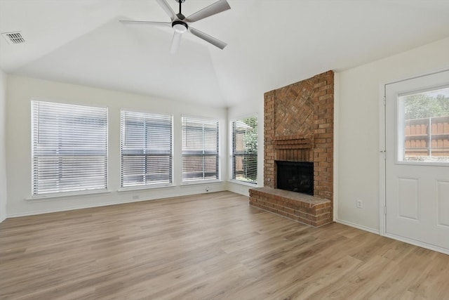 1800 Chatham Dr, Flower Mound, TX 75028 - unfurnished living room with light wood-style flooring, a ceiling fan, a fireplace, and high vaulted ceiling