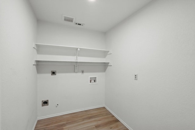 1800 Chatham Dr, Flower Mound, TX 75028 - laundry area with gas dryer hookup, electric dryer hookup, washer hookup, and wood finished floors